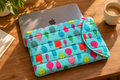 Print No. 2 Teal Fish Laptop Sleeve – lifestyle with MacBook