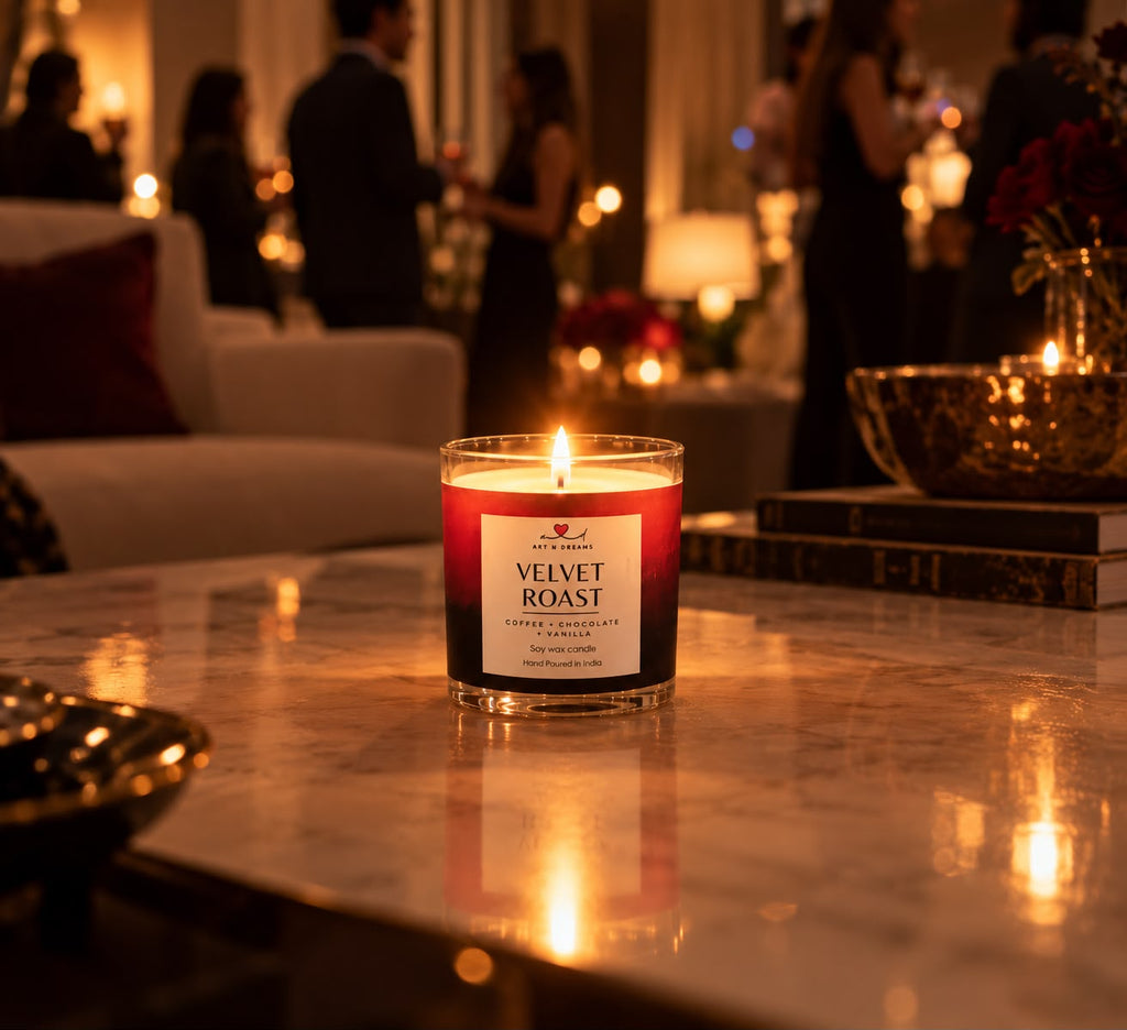 Velvet Roast candle glowing on a wooden table at night